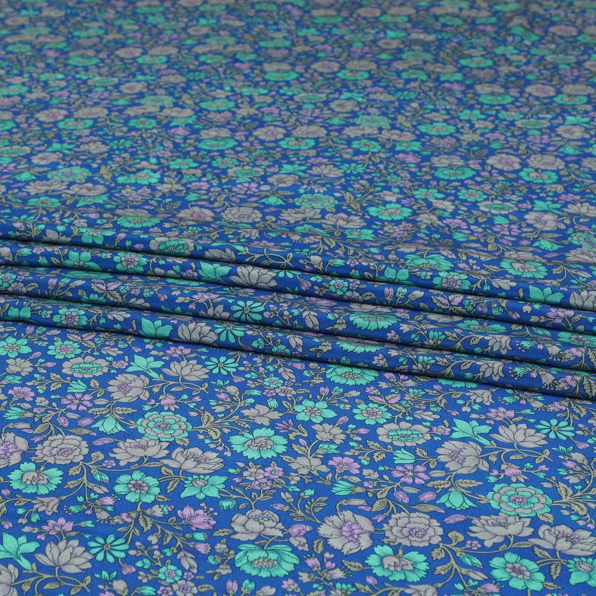 Royal blue silk crepe fabric with turquoise green, grey and lilac print in floral design-D8456